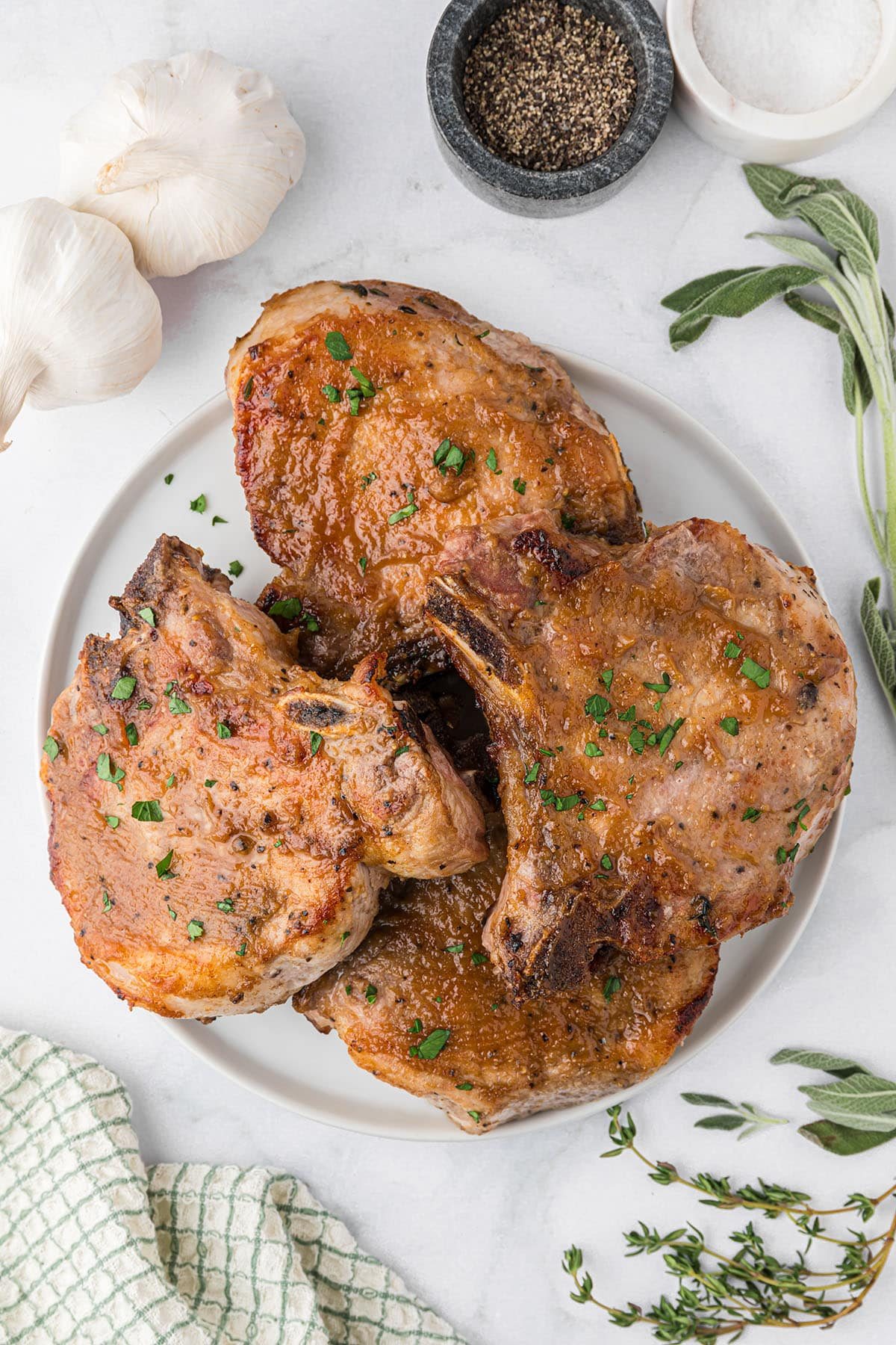 a plate of glazed pork chops on a table
