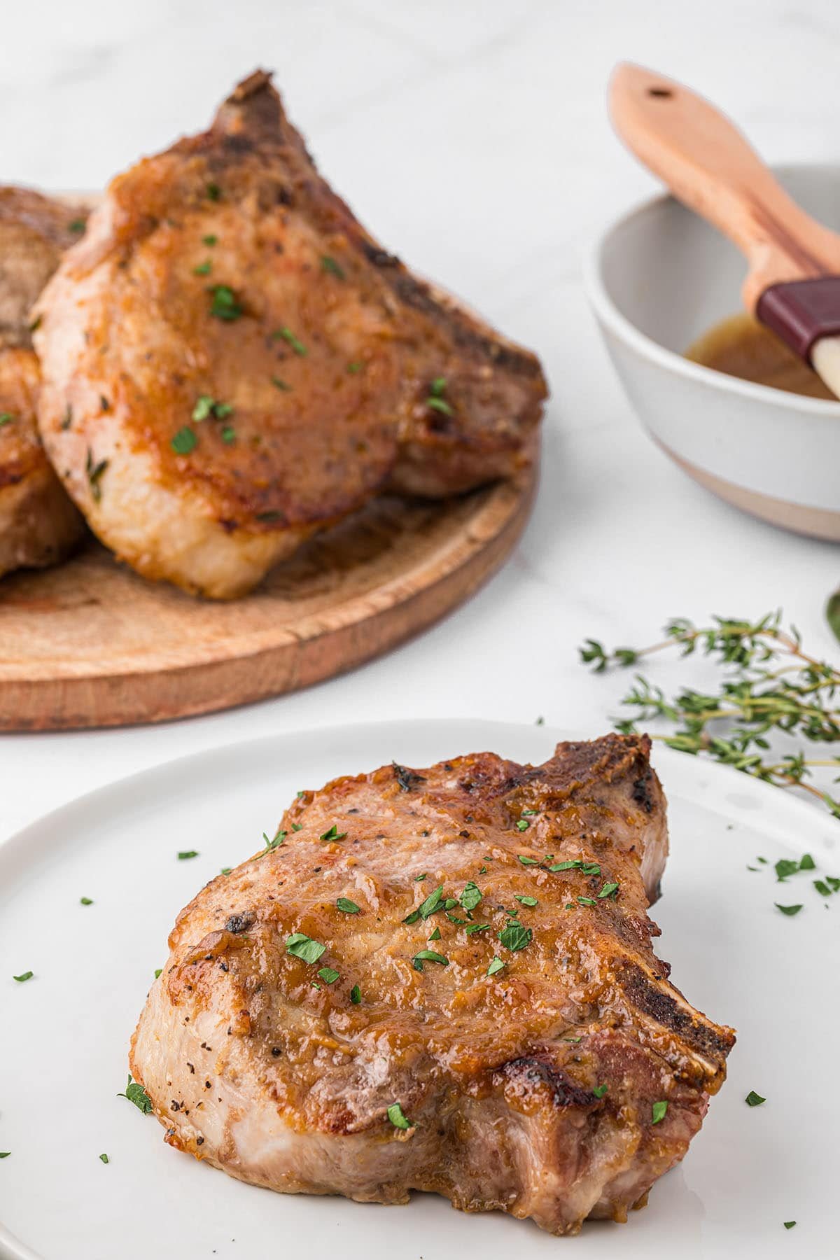 Oven baked glazed pork chops on a table