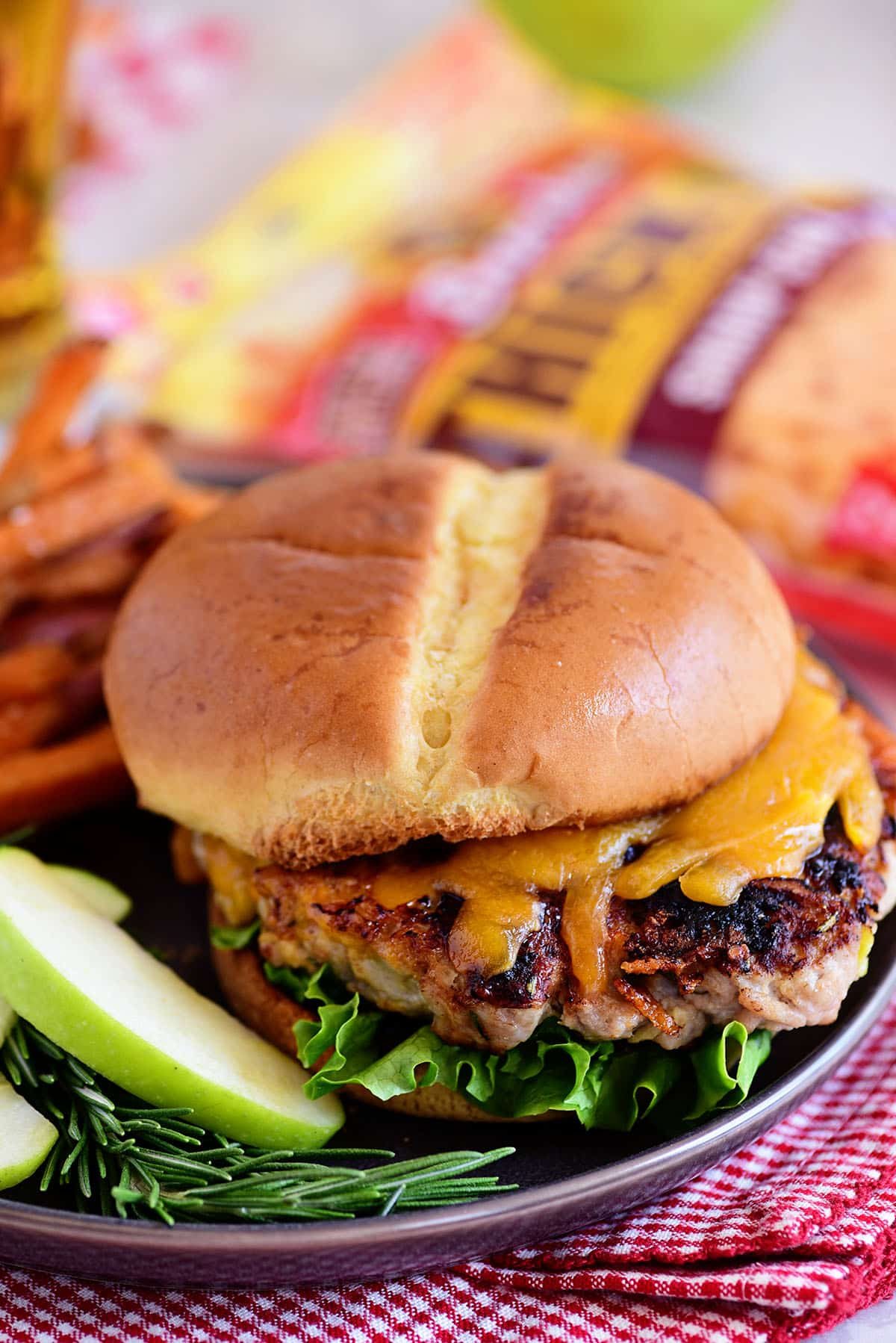 Apple Cheddar Pork Burgers are a simple dinner solution the whole family will devour!! Made with just five ingredients and packed with flavor, tart apples and sharp cheddar (inside and out) are going to elevate your burgers to a whole new dimension with an unexpected flavor that everyone is going to love! Print full recipe at cetcu.com #burgers #pork #cheese