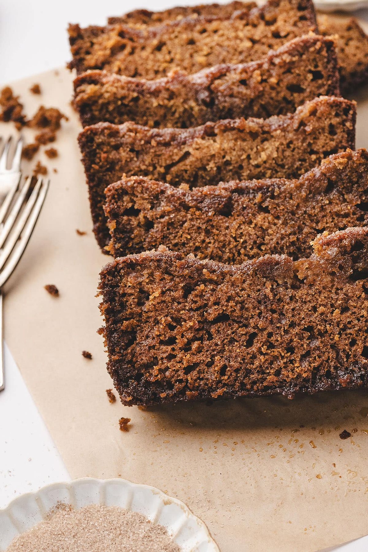 moist-apple-cider-bread sliced on a cutting board