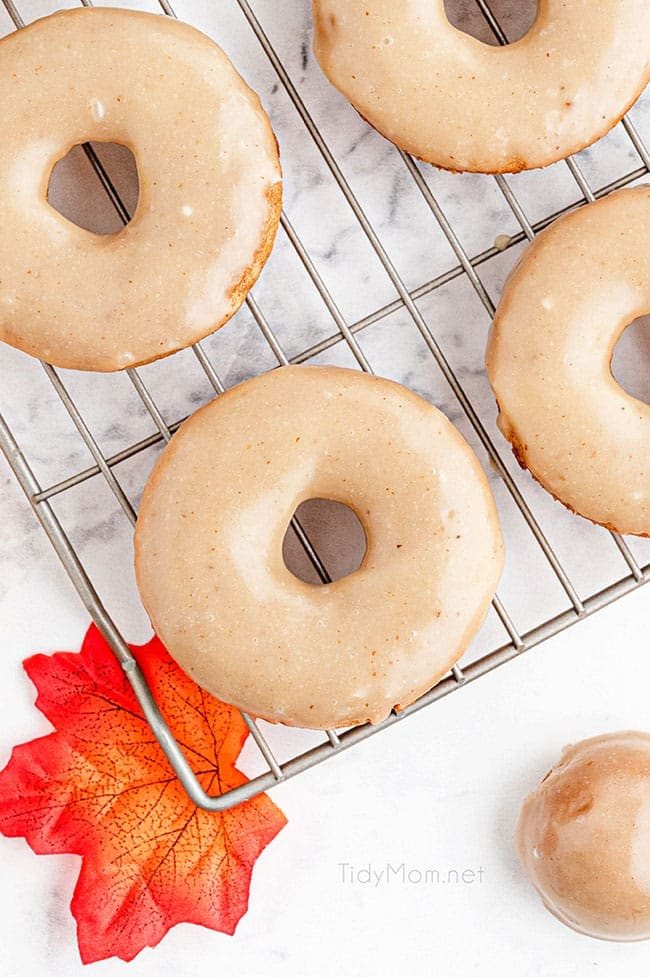 glazed apple cider donuts on a cooling rack