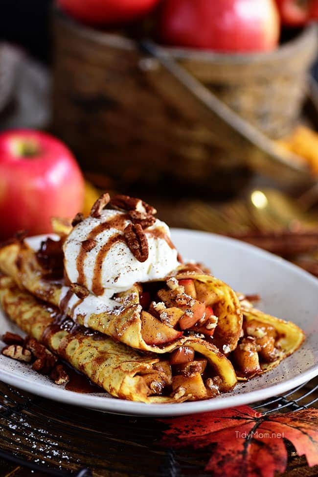 This Apple Crepes recipe is perfect for fall. The thin French pancakes are filled with a gooey caramel apple compote with toasted cinnamon pecans.