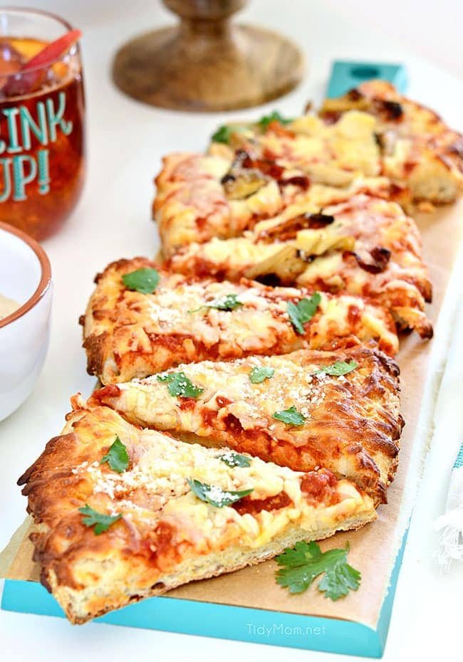 Girls Night Pizza Party! Customize a DIGIORNO Originial Rising Crust Four Cheese with your own toppings, like this Grilled Artichoke, Chicken and Sun-Dried Tomato Pizza with parmesan cheese. While the pizza bakes for about 20 minutes, set up a salad bar! Details at cetcu.com