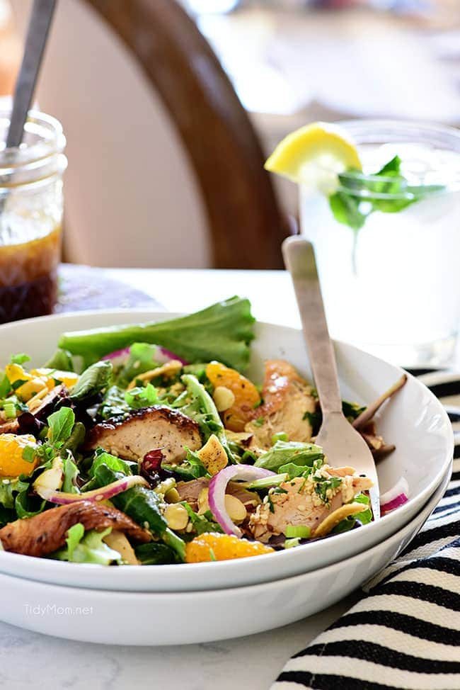 asian chicken salad in a white bowl