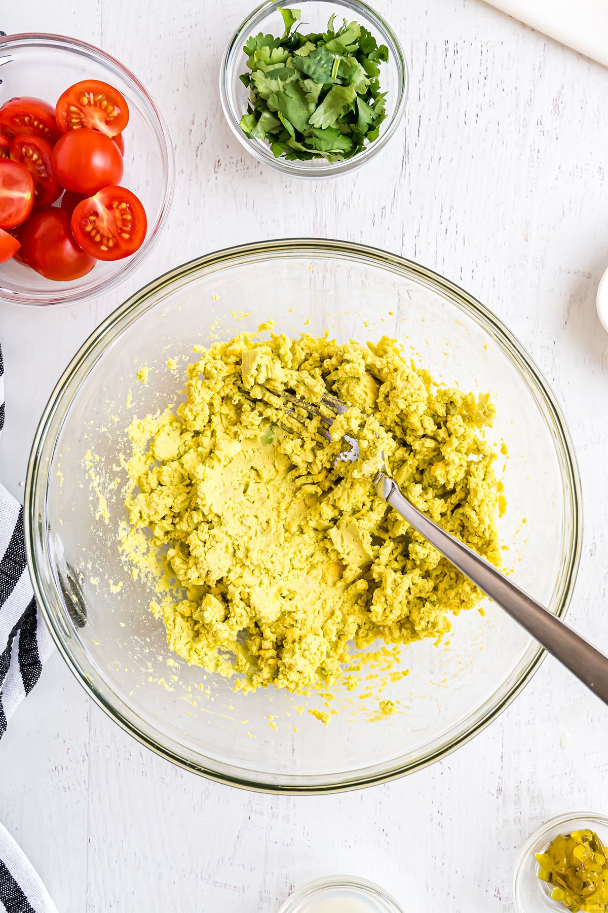 deviled egg filling in a glass mixing bowl