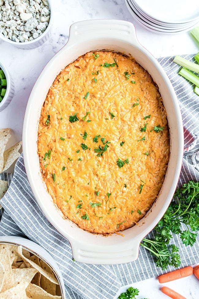 over head look at baked buffalo chicken dip in a baking dish