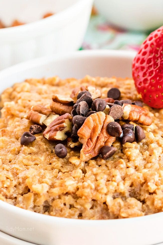 baked peanut butter oatmeal topped with chocolate chips and pecans