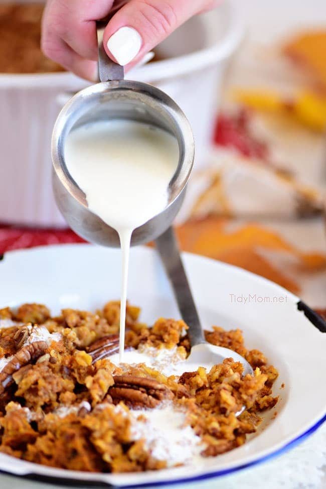 pouring milk over baked pumpkin oatmeal