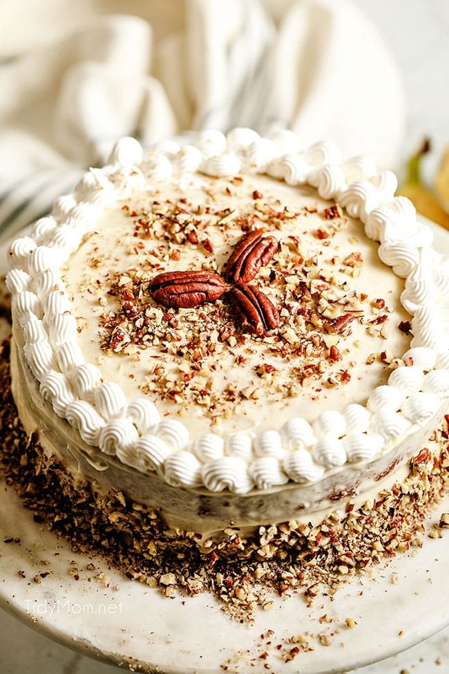 top of banana cake with pecans for garnish