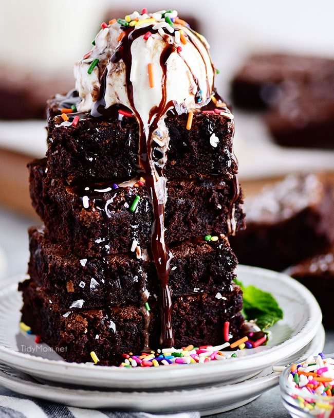 the best brownies stacked with a scoop of ice cream on top