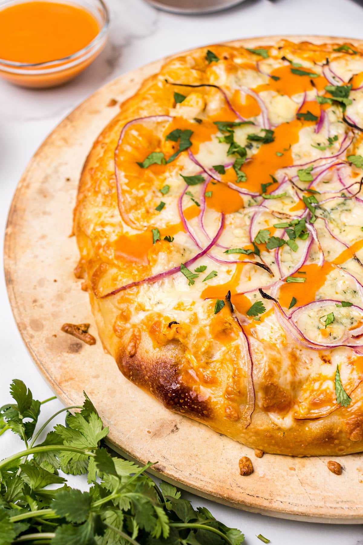 Easy buffalo chicken pizza on a hot pizza stone