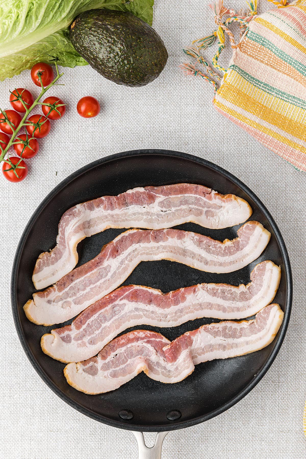 frying bacon in a pan