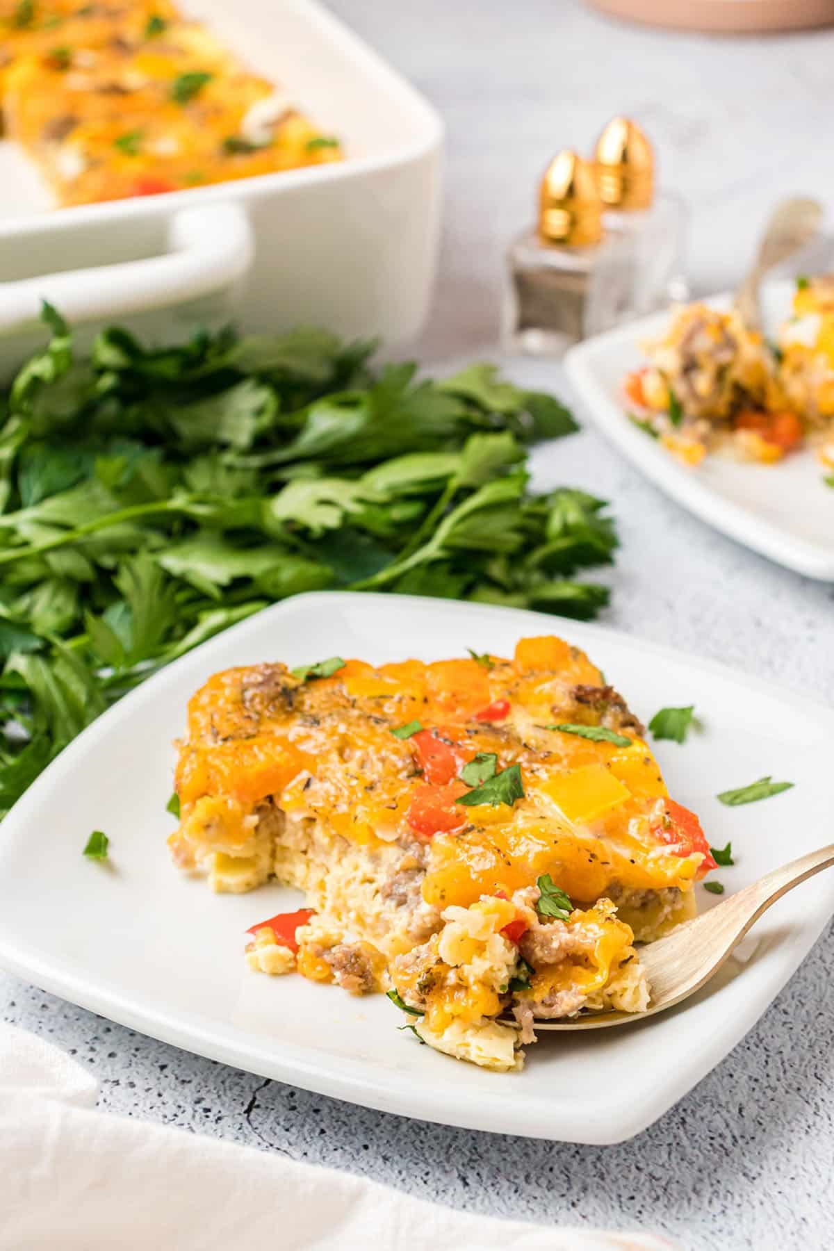 a plate with a serving of egg casserole on a white plate