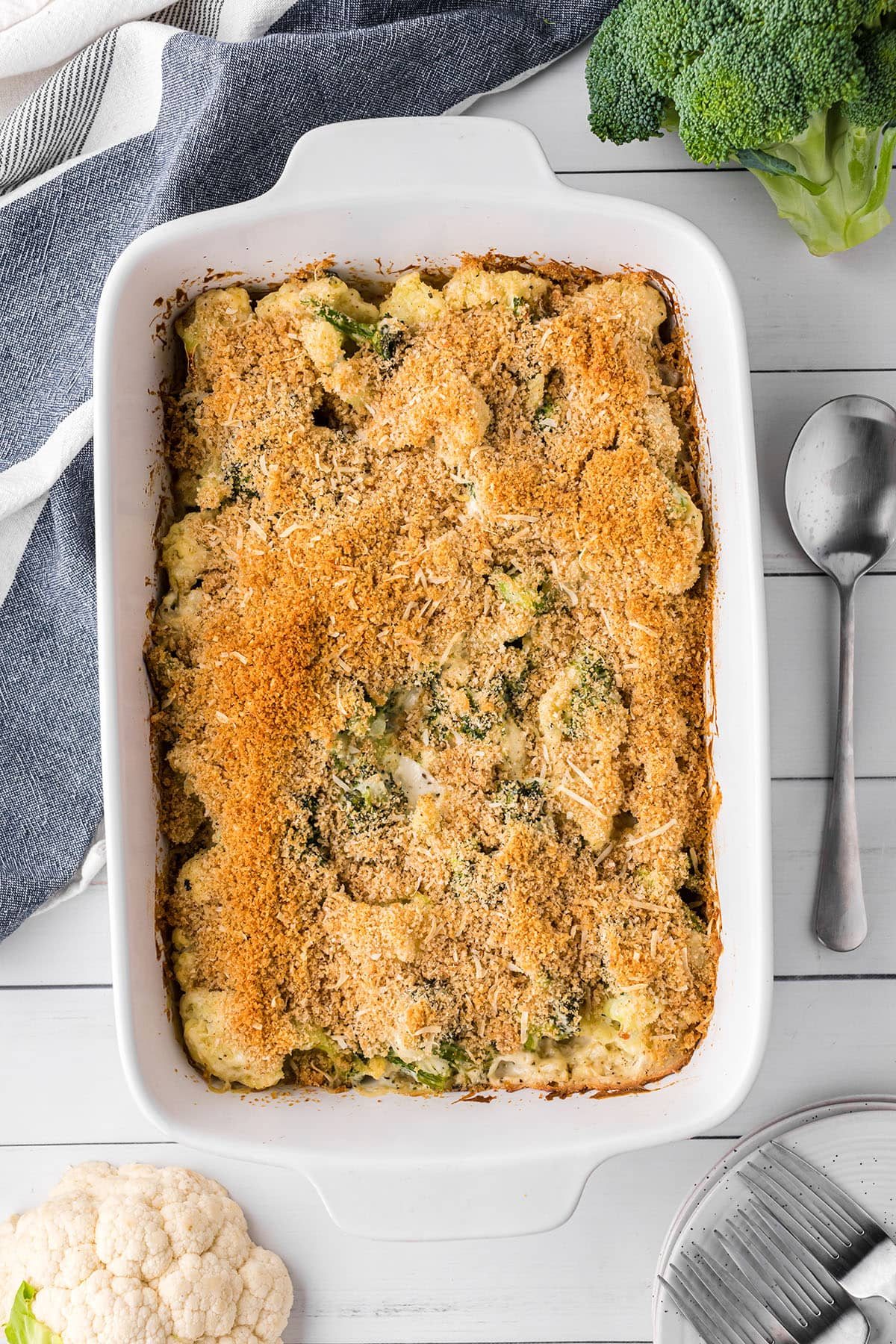 Cheesy Broccoli Cauliflower Casserole in white baking dish