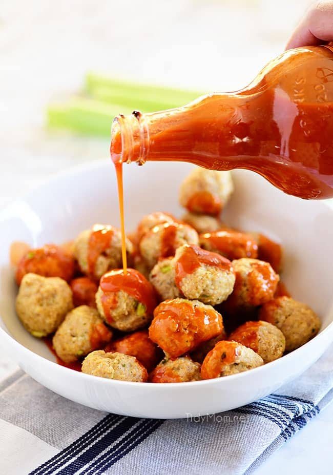 drizzling sauce over Chicken Meatballs