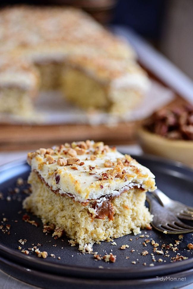 Caramel Butter Pecan Cake With Bourbon Frosting sliced on a plate