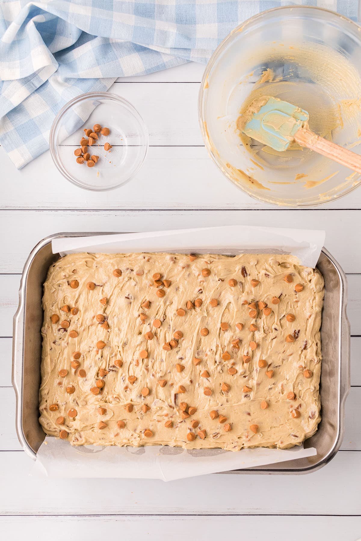 butterscotch brownie batter in a 9x13 metal pan