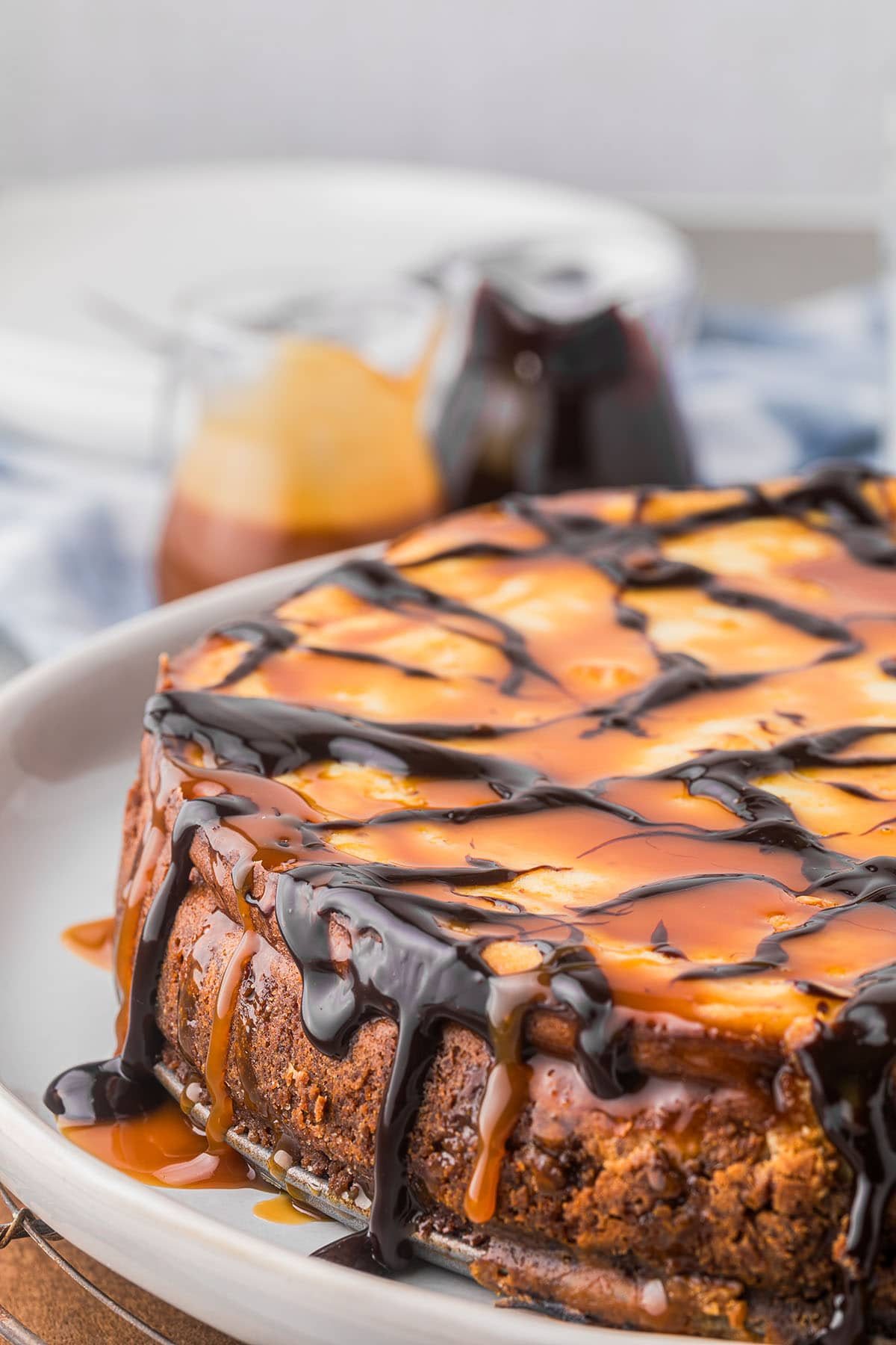 chocolate syrup dripping down side of cheesecake