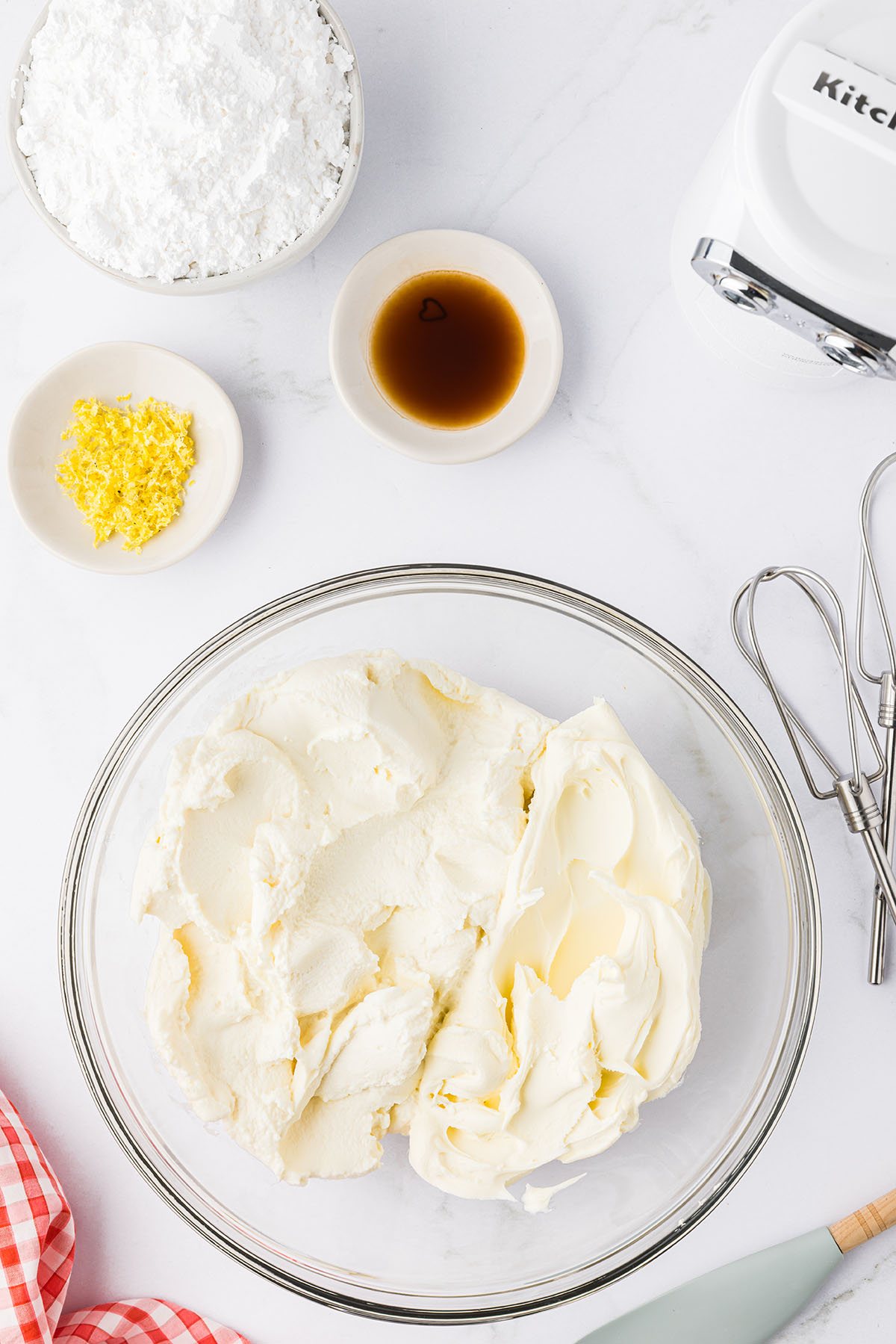 making cannoli dip in glass bowl with electric mixer