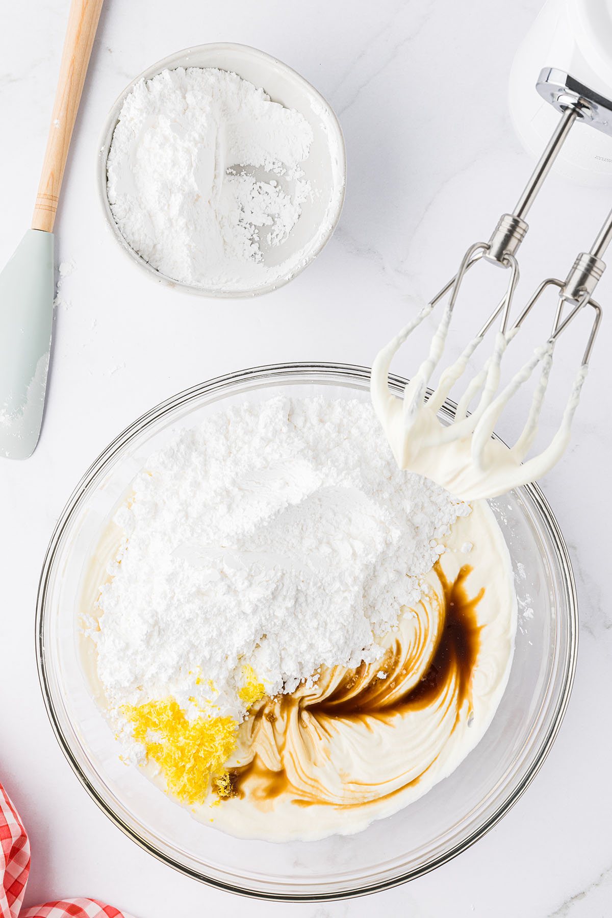 dip in glass bowl with with electric hand mixer