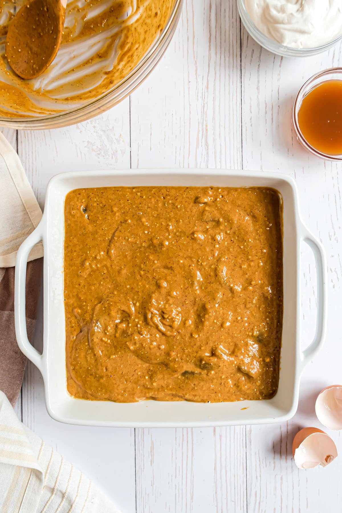 cake batter in a white square baking dish
