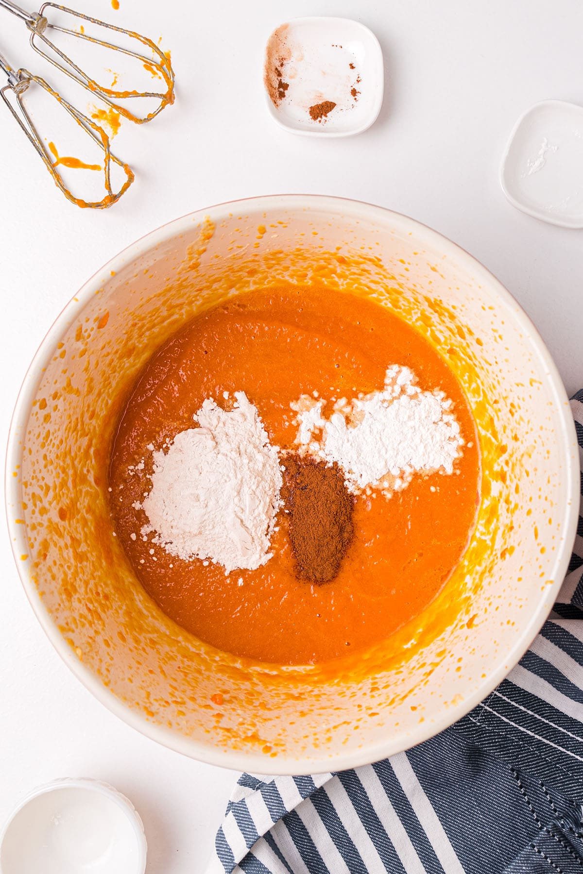 spices added to souffle batter in mixing bowl