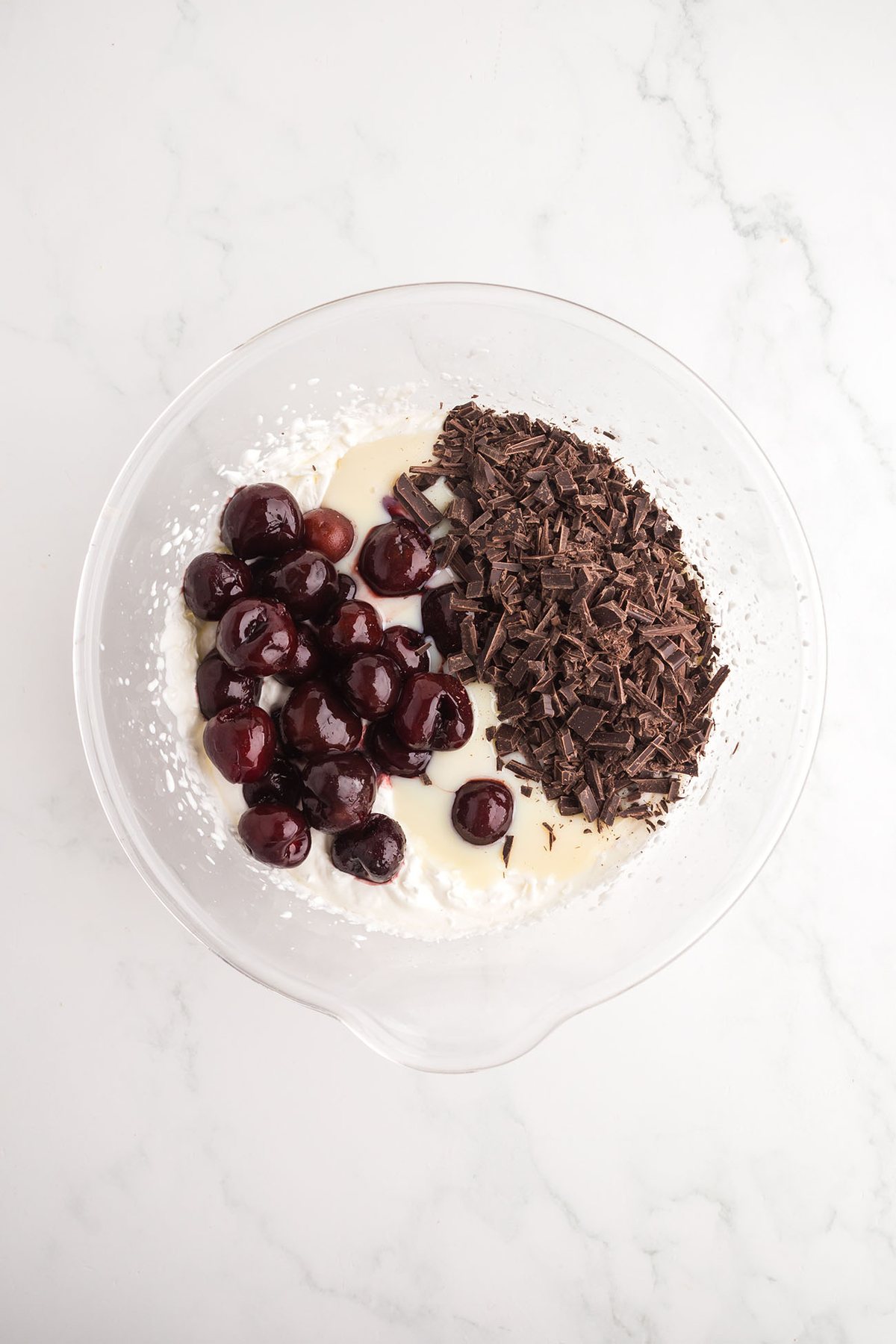 whipped cream mixture with cherries and chocolate for homemade Cherry Garcia ice cream