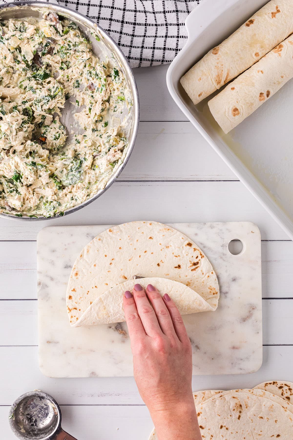 rolling enchiladas for casserole