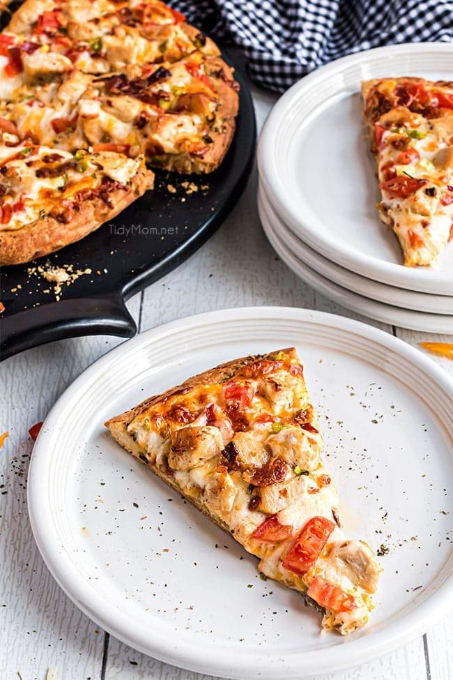 a slice of chicken bacon ranch pizza on a plate
