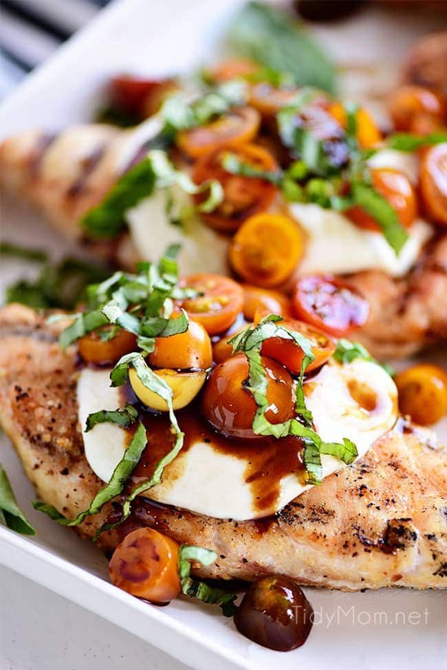 grilled chicken breasts topped with caprese salad