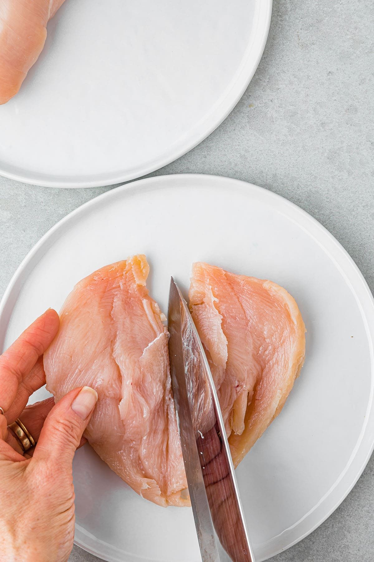 cutting a chicken breast in half