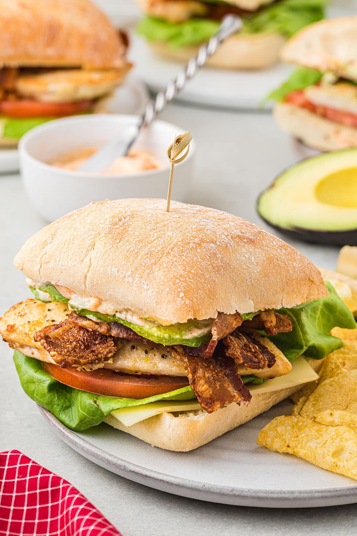 chicken bacon sandwich on a plate with homemade dressing