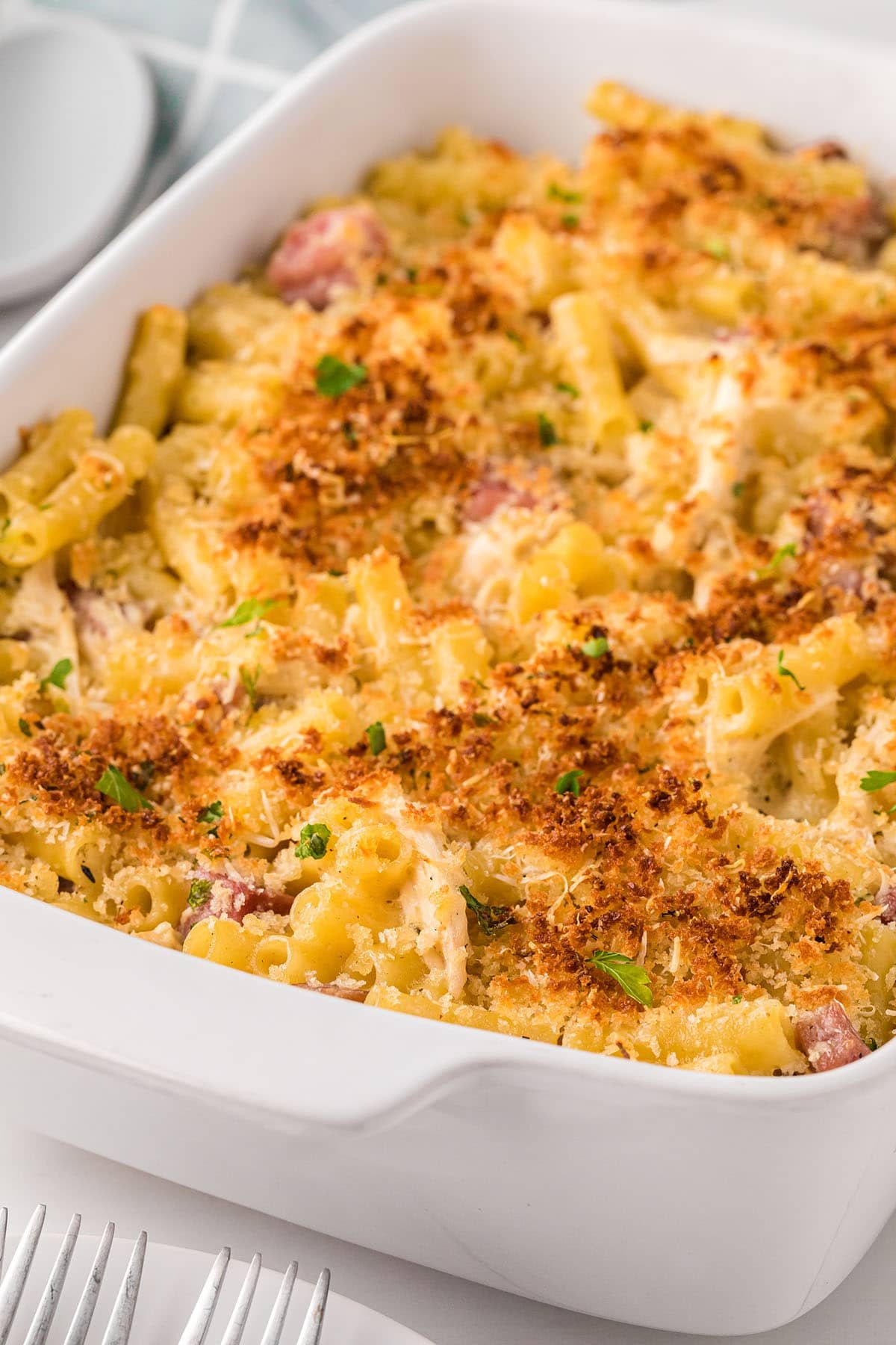 white baking dish filled with Chicken Cordon Bleu Casserole