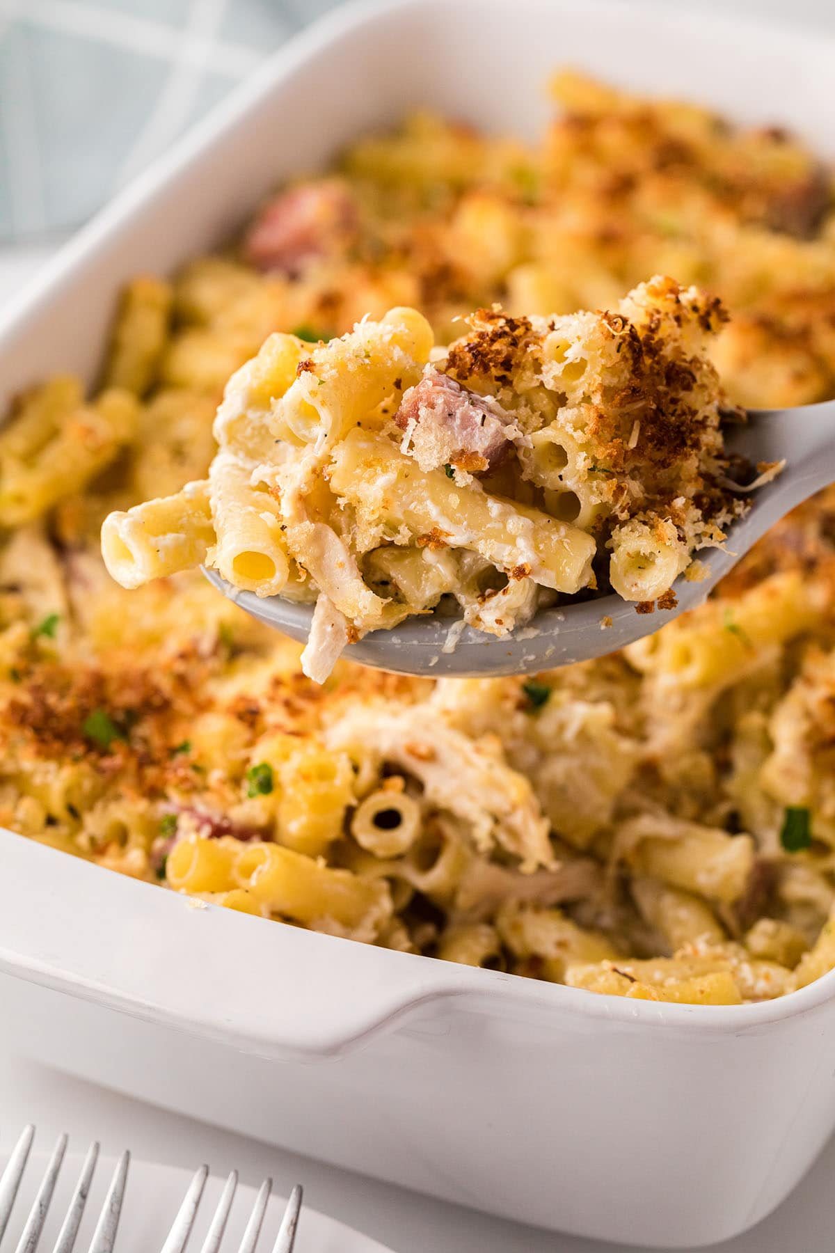 Chicken Cordon Bleu Casserole With Pasta on a serving spoon