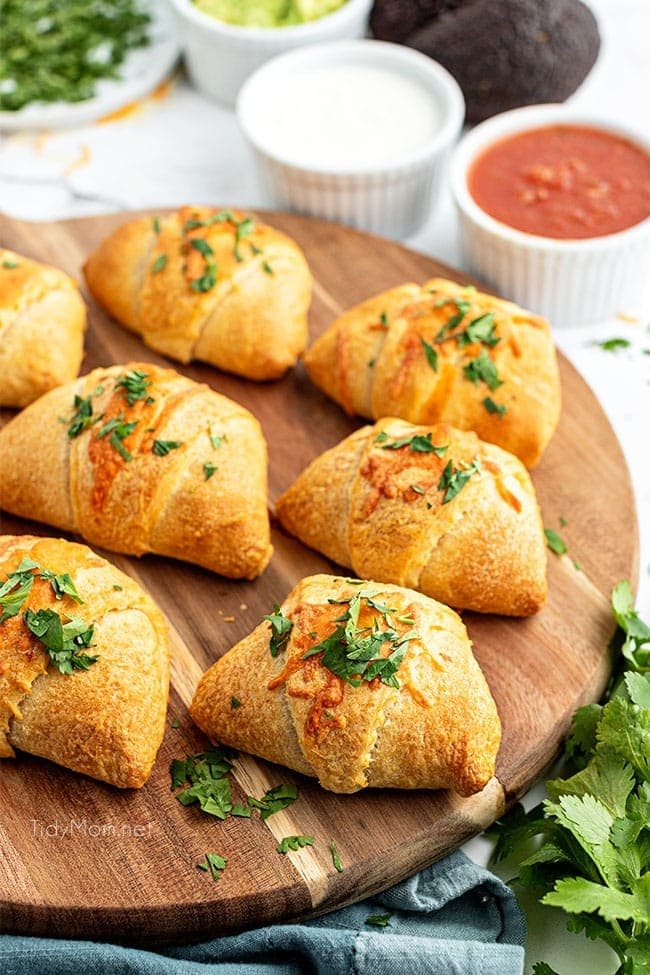 enchilada puffs on a wood tray