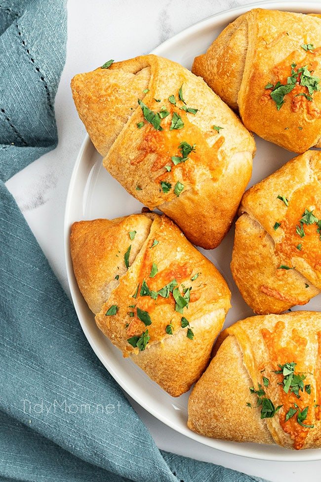 overhead shot of enchilada puffs on a white plate