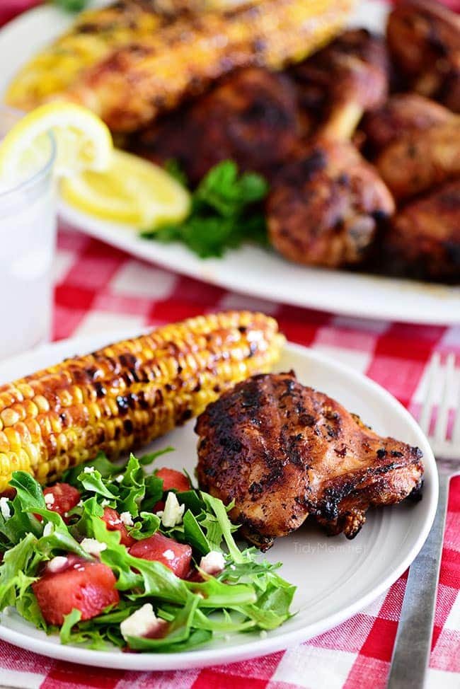 plate of easy lemon herb grilled chicken corn and salad