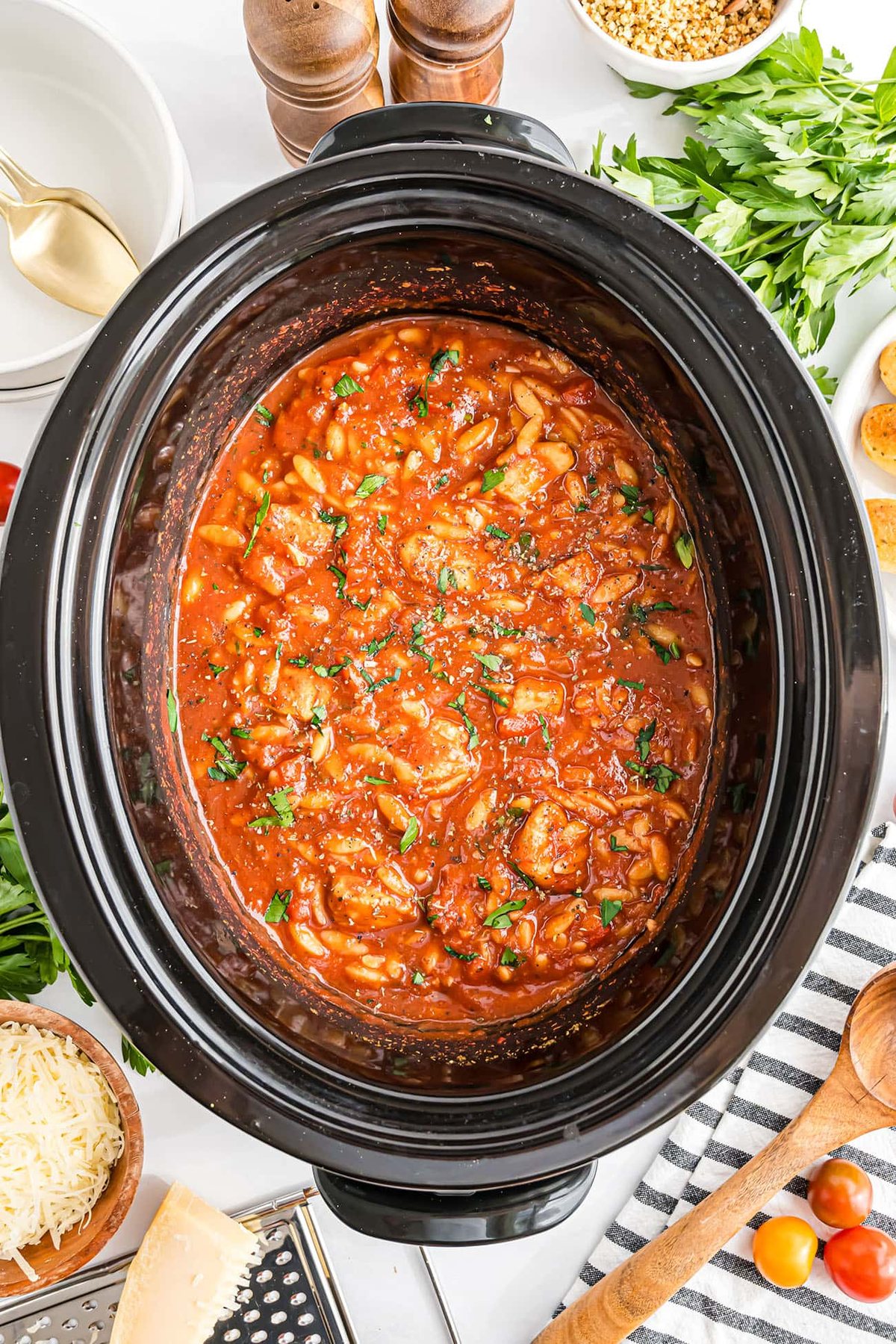 Slow cooker filled with Chicken Parmesan Soup ready to serve.