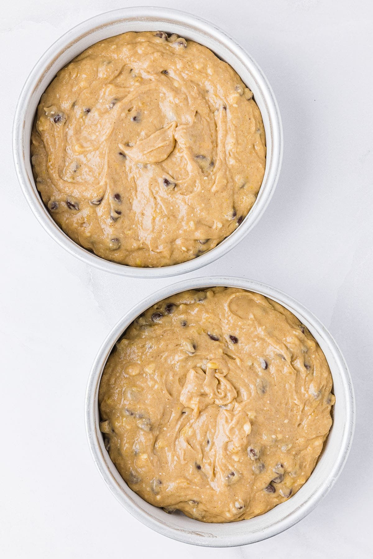 banana cake batter in round cake pans