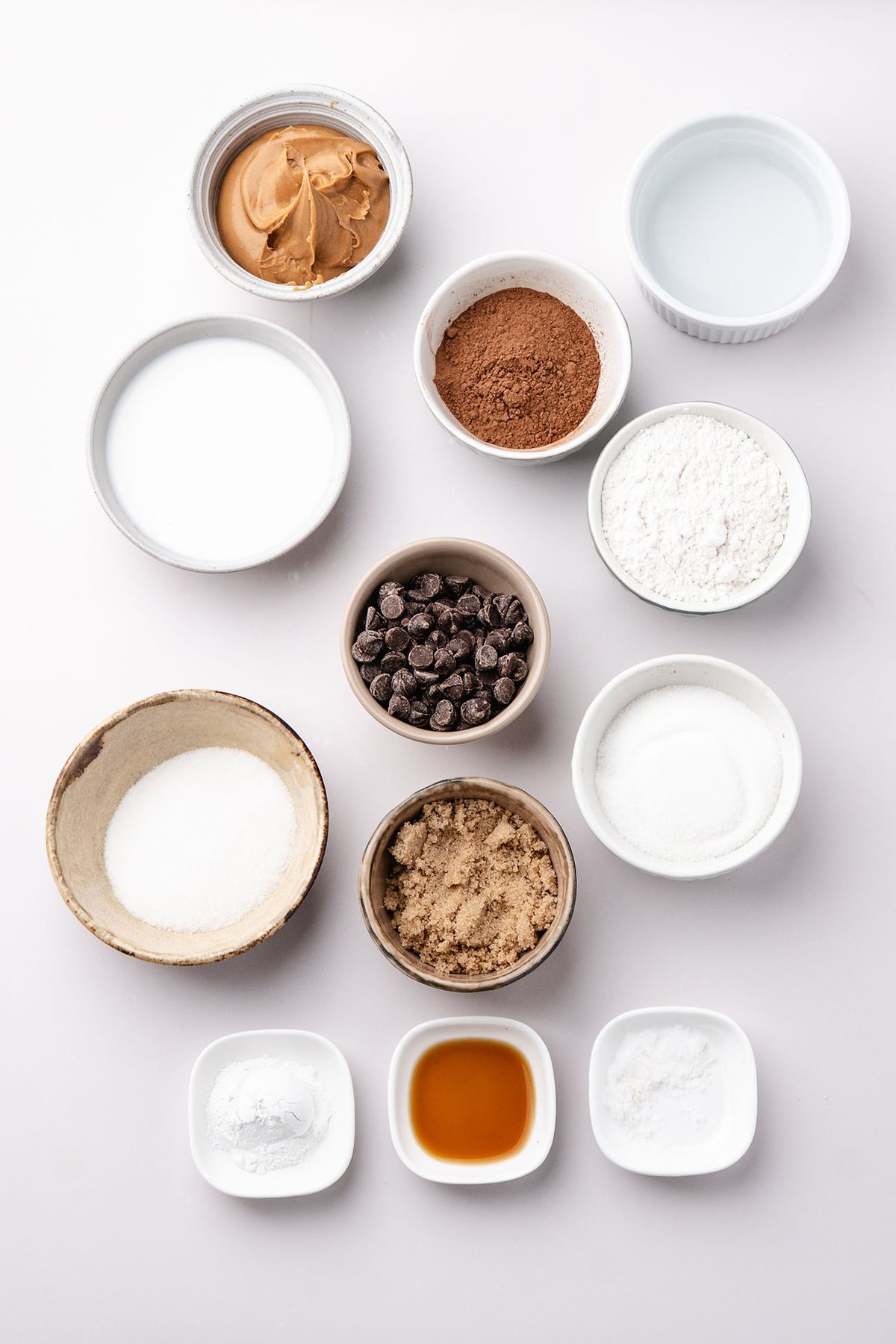 Ingredients for chocolate cobbler with peanut butter arranged in bowls