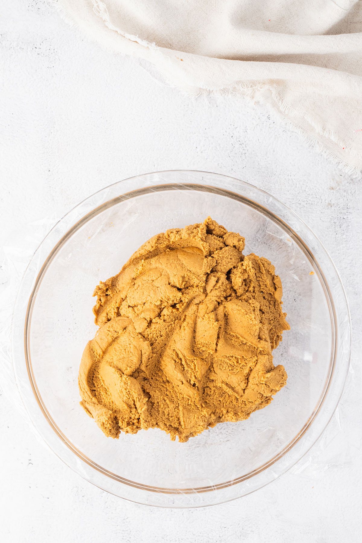 cookie dough in glass mixing bowl