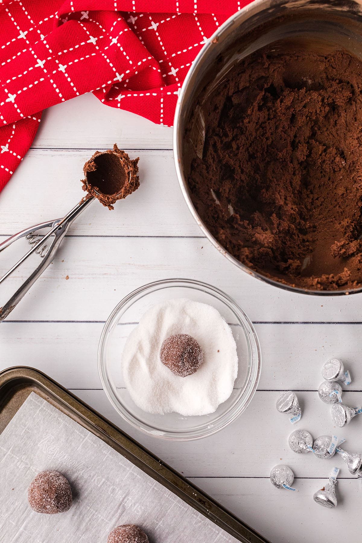 rolling cookie dough into balls with a cookie scoop