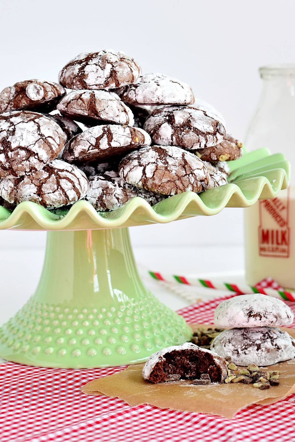 green cake stand stacked with crinkle cookies