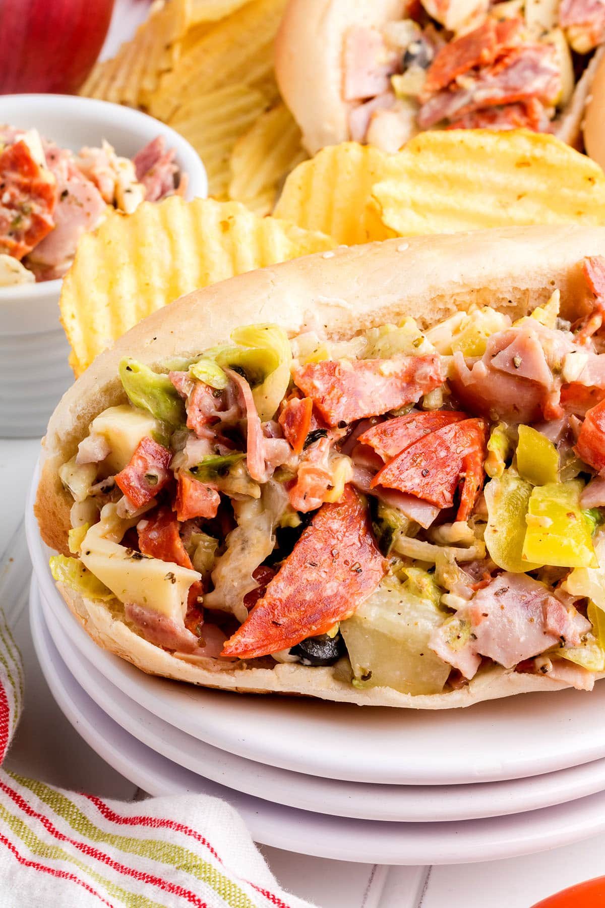 Chopped Italian Sandwich on a plate with potato chips