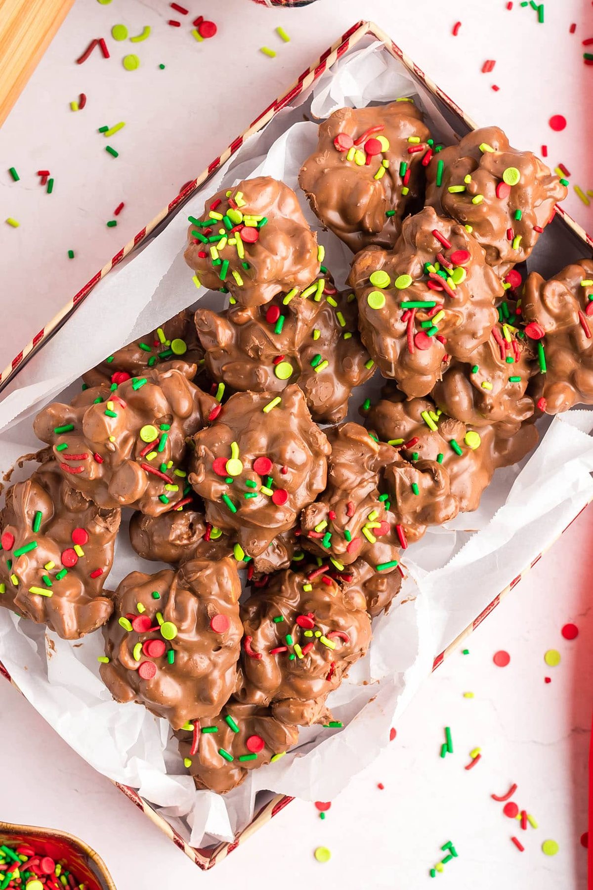 milk chocolate crockpot candy peanut clusters in a holiday box