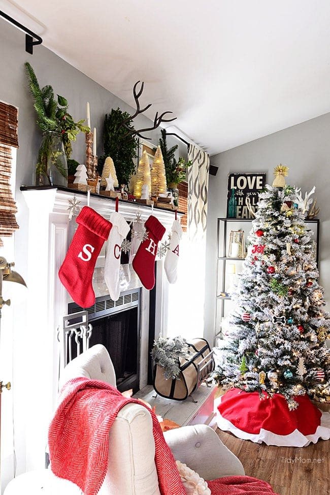 Merry and Bright Christmas Mantel Decor with rustic neutrals and a touch of red and green. Details at cetcu.com