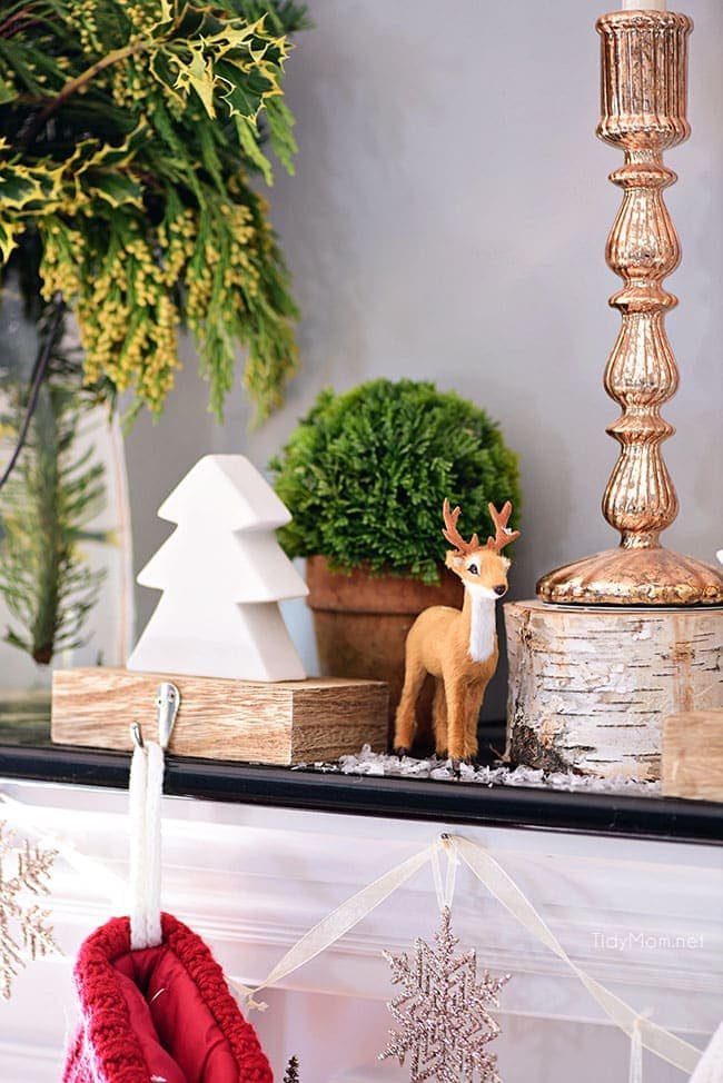 Deer + Tree Stocking Holder. Merry and Bright Christmas Mantel Decor with rustic neutrals and a touch of red and green. Details at cetcu.com