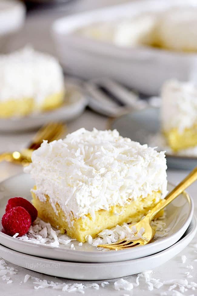 coconut cake on a plate with a gold fork