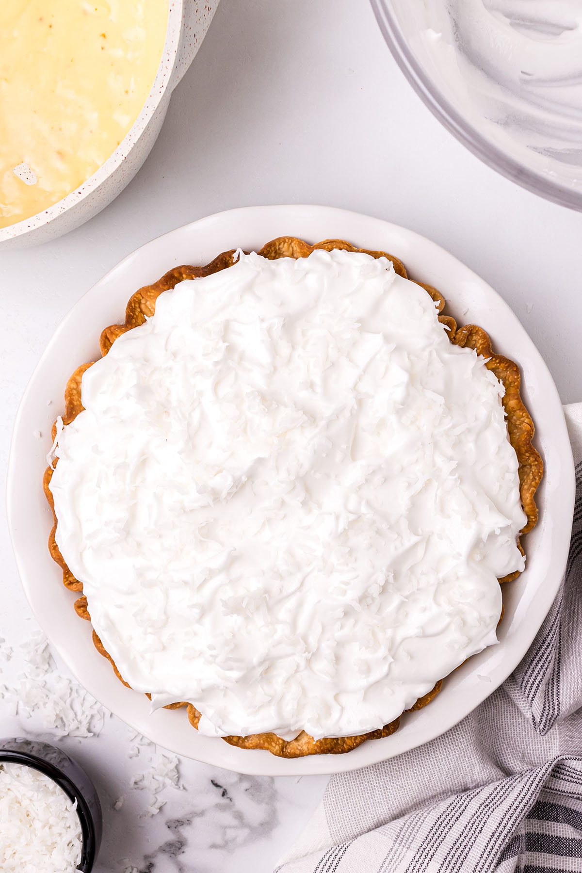 meringue spread and sealed over pie and ready to bake