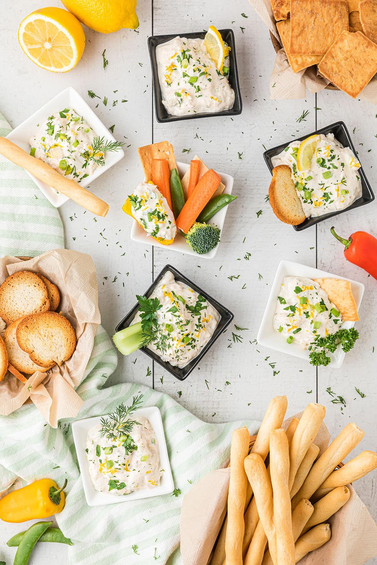 dip in single serve dip bowls with various dipping veggies, crackers and breads